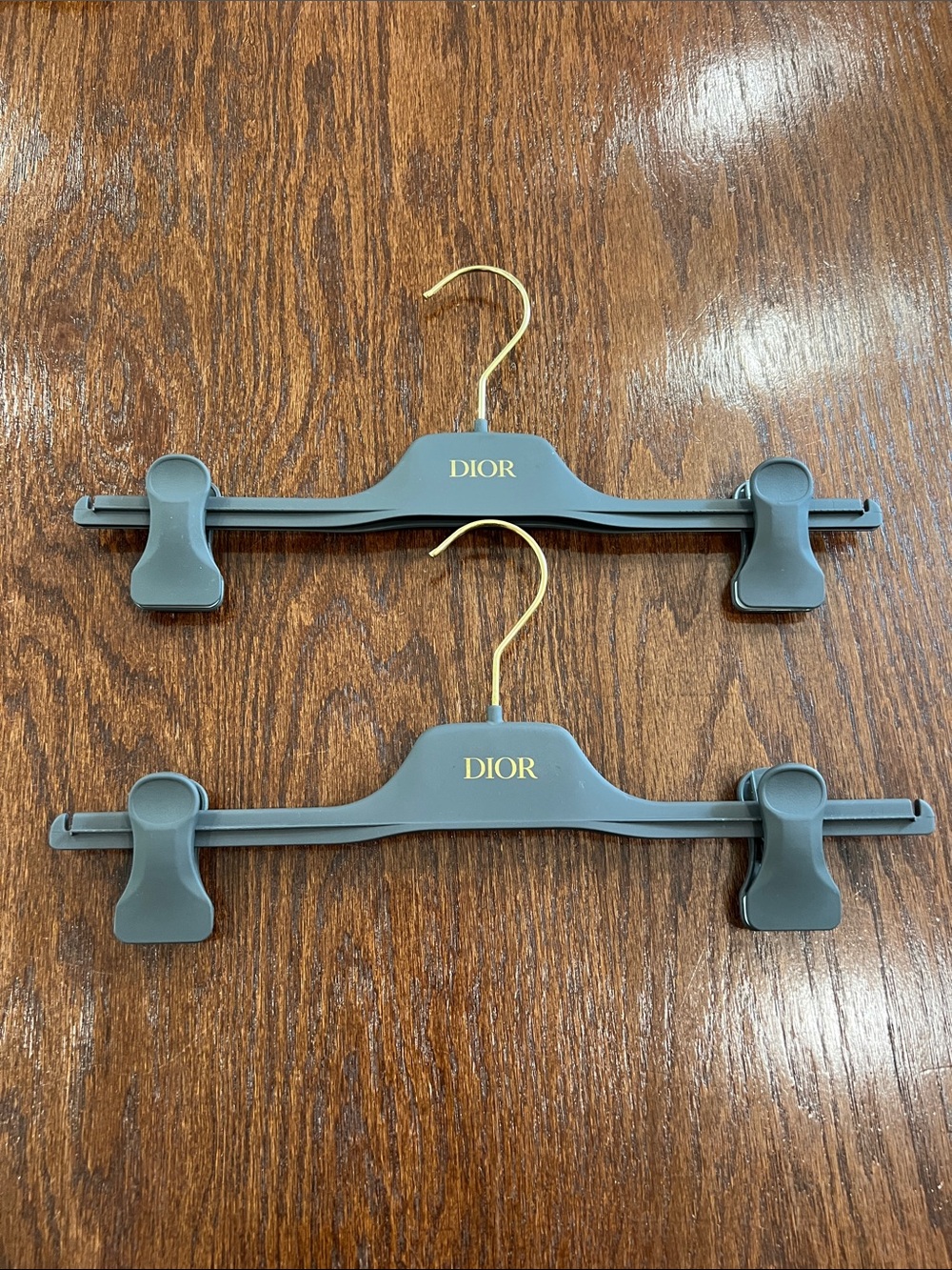 Dior Gray and Gold Clip Hangers Set off 2